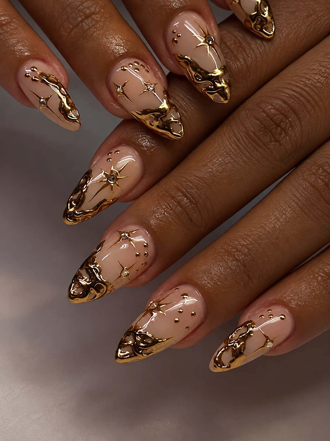 Elegant nude and gold nail design